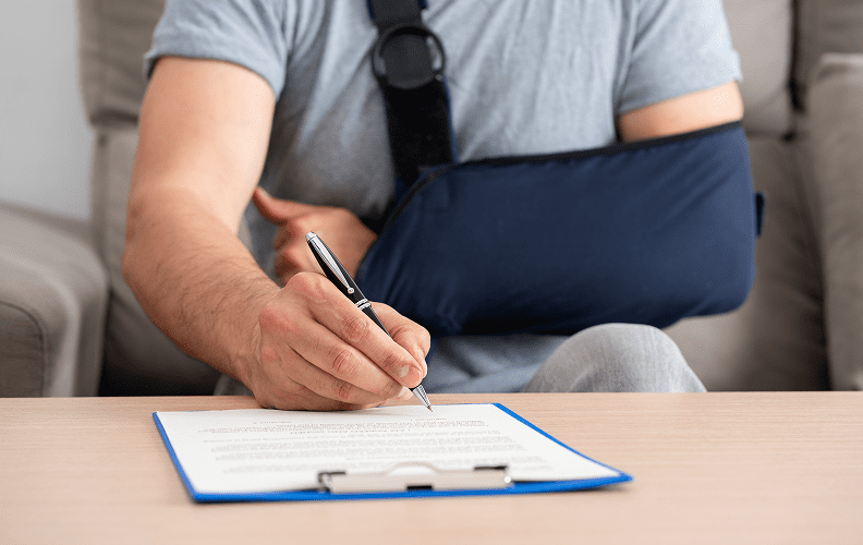 Writing with arm in sling